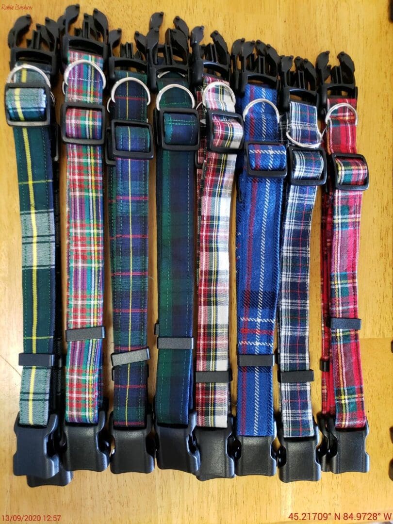 A group of different colored plaid collars.