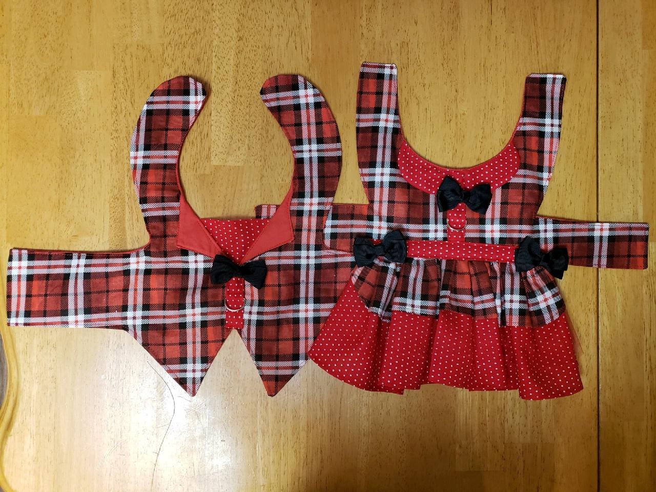 A couple of red and white plaid dog bibs.