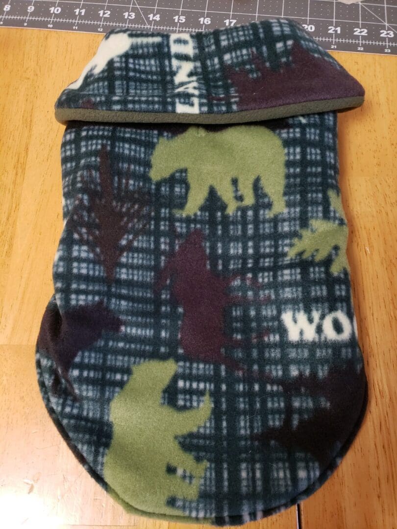 A bear and plaid pattern is on the bottom of this sleeping bag.