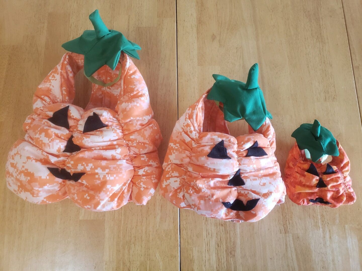 A pair of orange shoes with faces made out of paper.