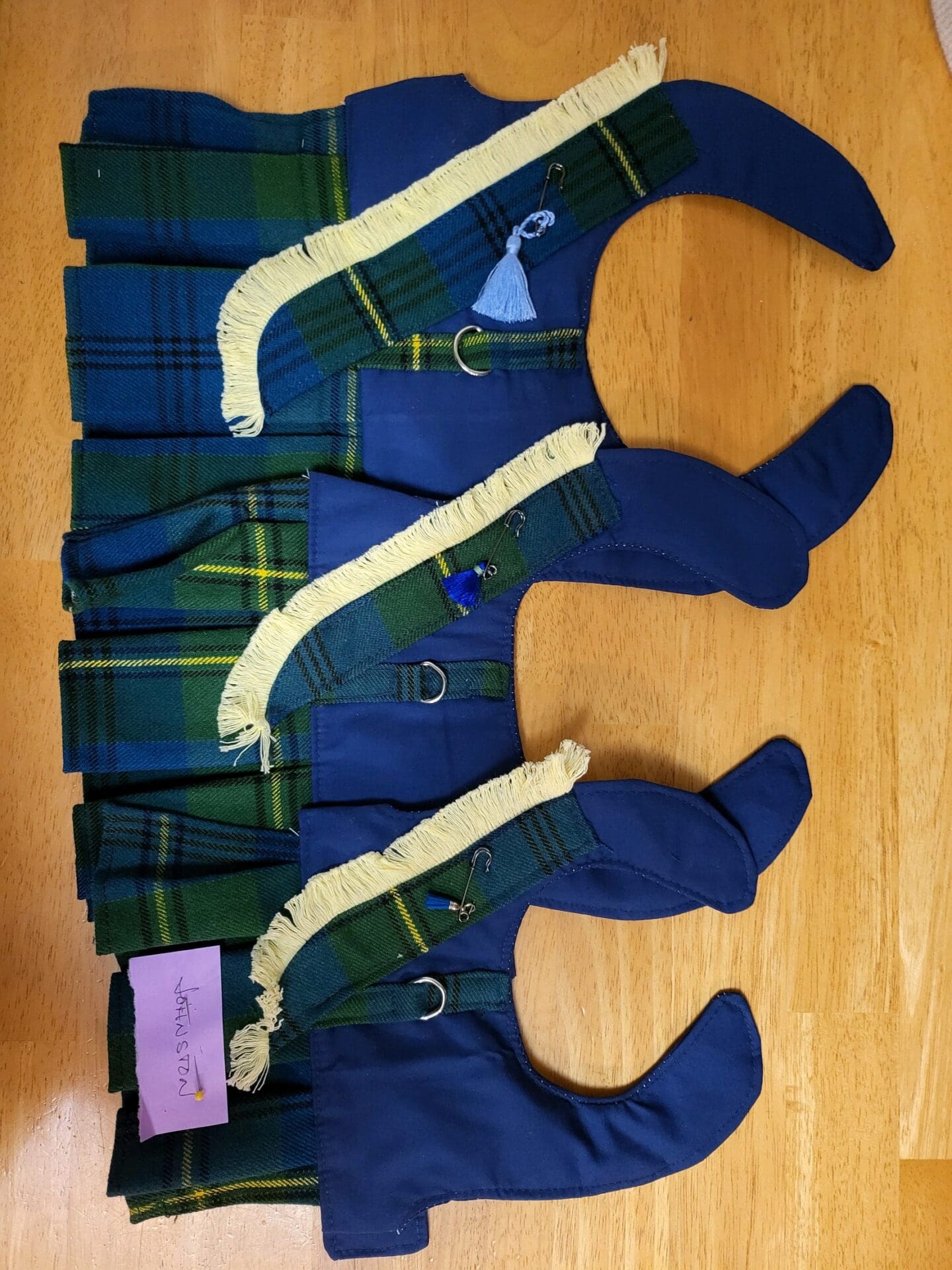 A group of blue and green stockings on the floor.