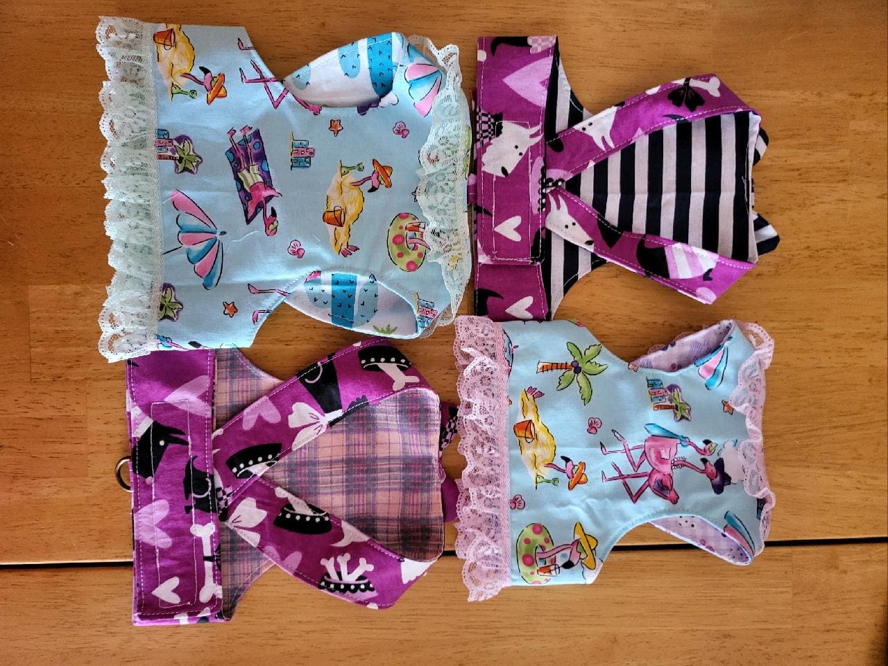 Four different types of cloth diapers on a table.