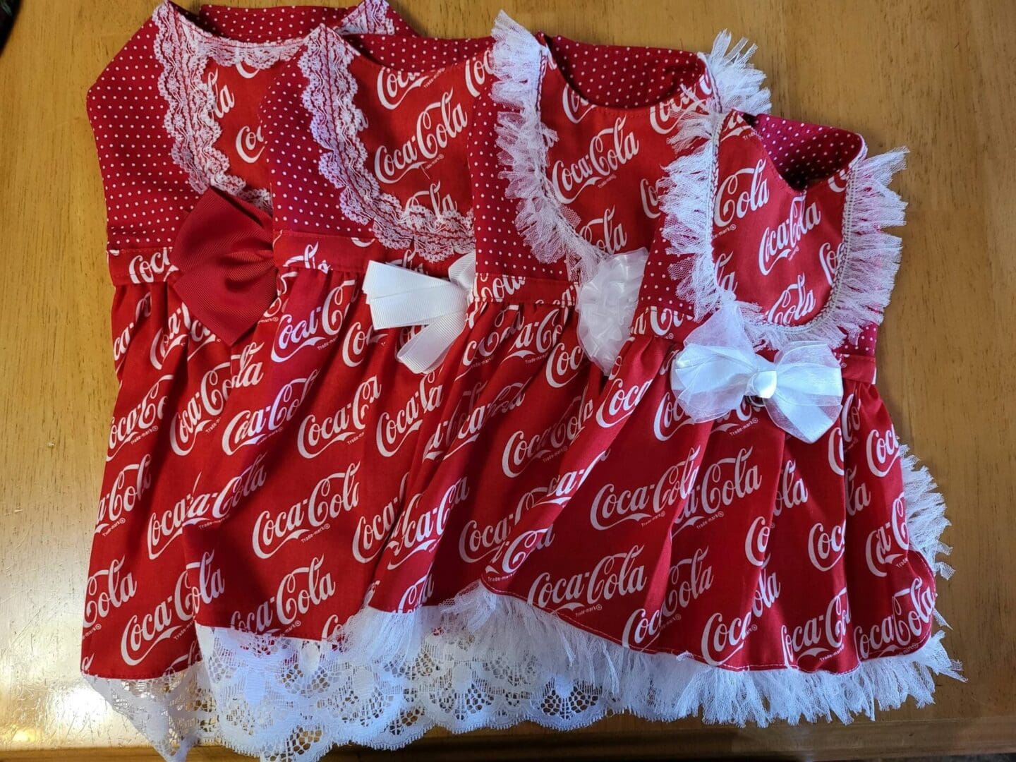 A group of dresses made out of coca cola bottles.