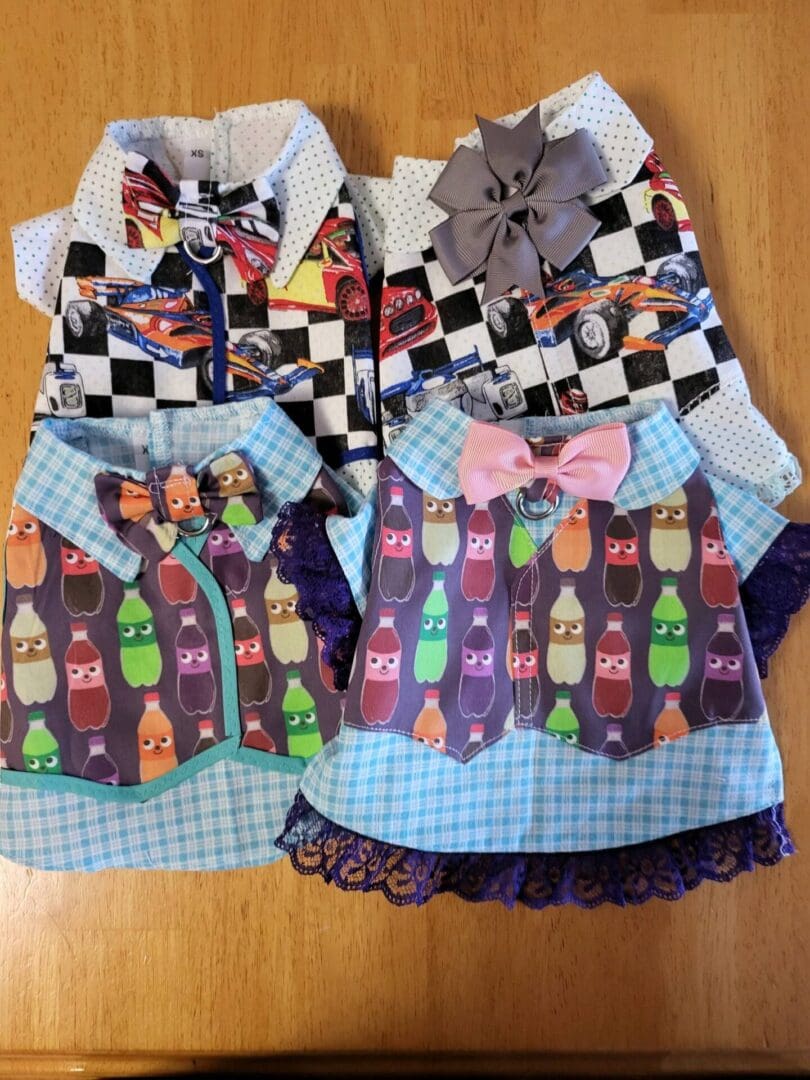 Two dresses with ties and a bow tie on them.