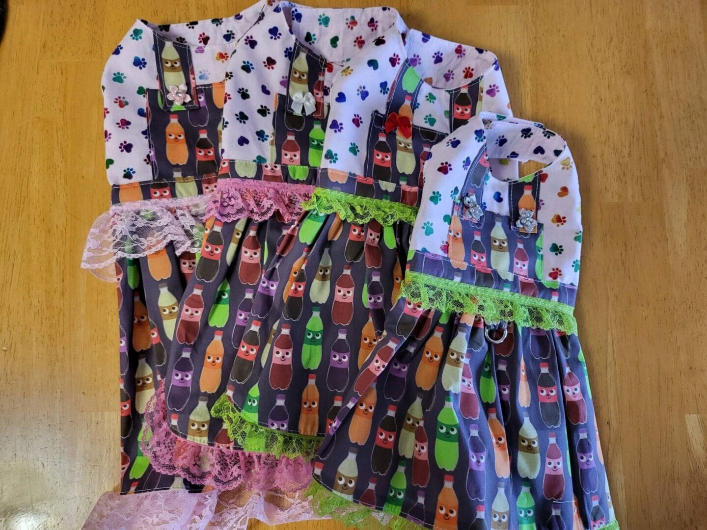 A group of four aprons with different designs.