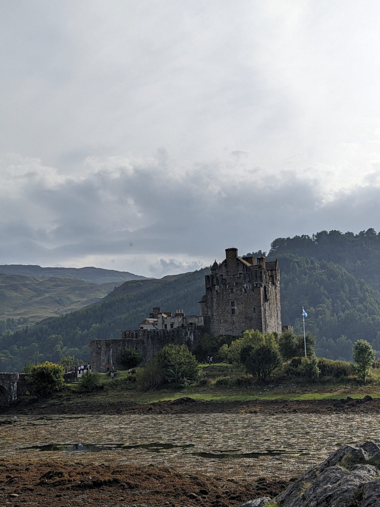 A castle sits on top of a hill.