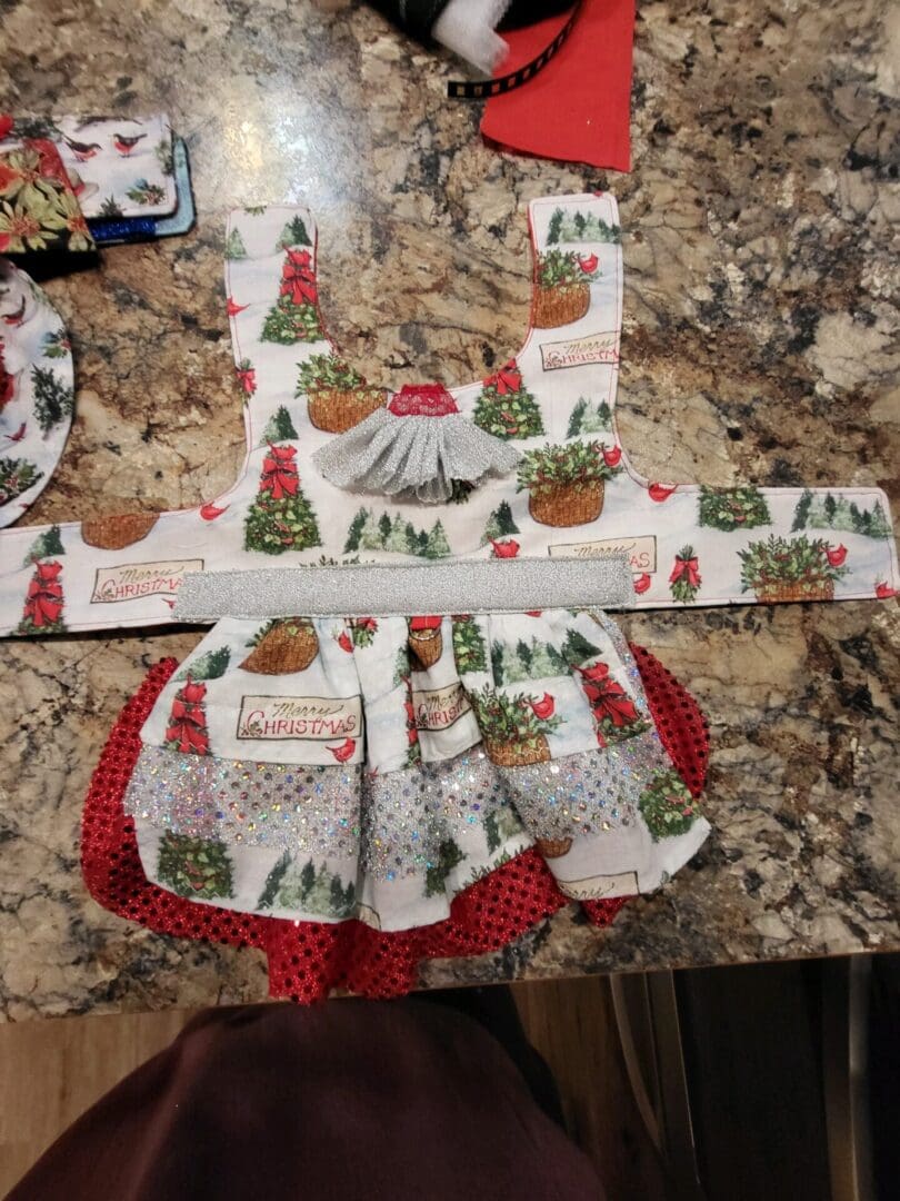 A kitchen counter with a apron and napkin on it